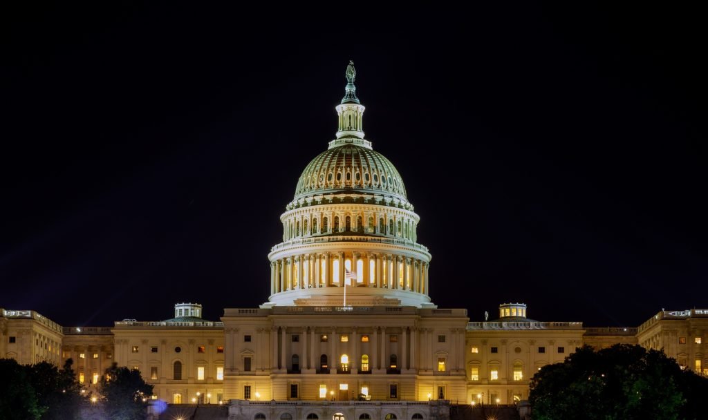 Capitol the United States building with the dome lit up at night the Senate House sides of the